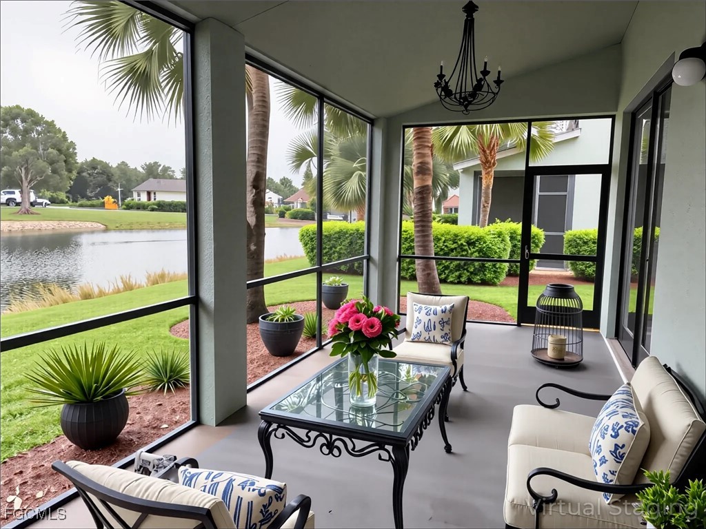 14764 Pinnacle Place Naples, FL 34119 - Photo 15 of 15 a living room with furniture and a floor to ceiling window