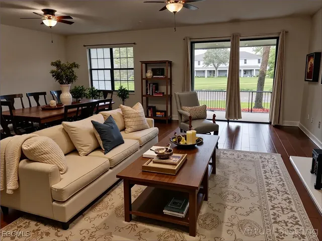 a living room with furniture and a rug