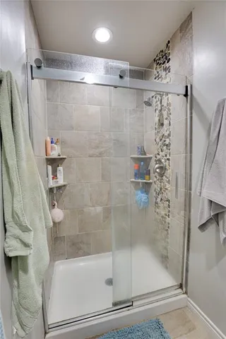 a bathroom with a shower and a bathtub