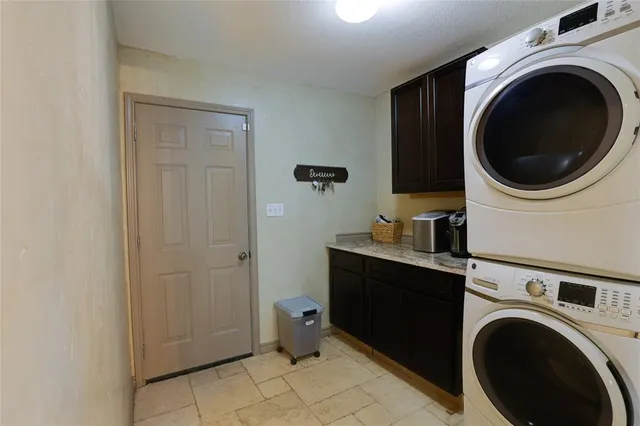 a view of a hallway with washer and dryer
