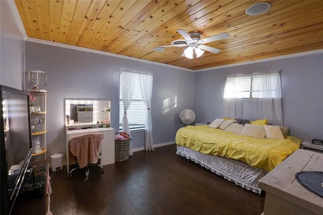a bed room with a bed and a chandelier