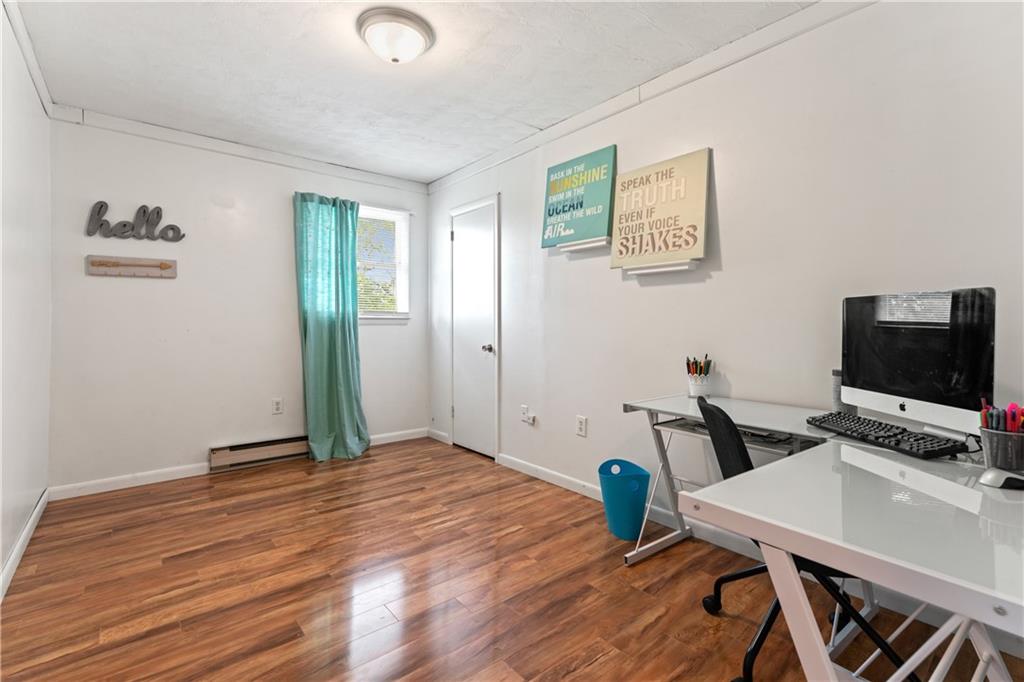 154 Central Road Tarrs, PA 15688 - Photo 17 of 24 a view of a workspace with furniture and wooden floor