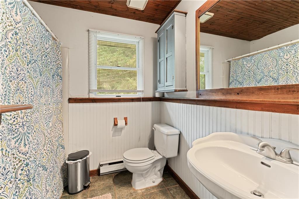 154 Central Road Tarrs, PA 15688 - Photo 20 of 24 a bathroom with a toilet sink and mirror