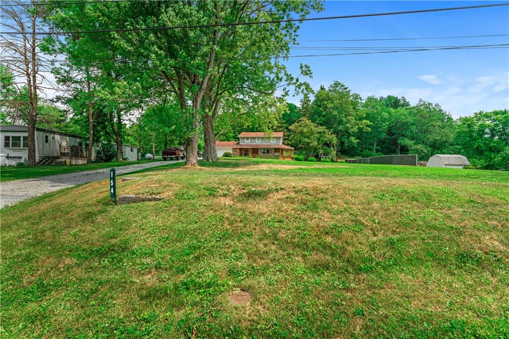 154 Central Road Tarrs, PA 15688 - Photo 4 of 24 a front view of a house with a yard