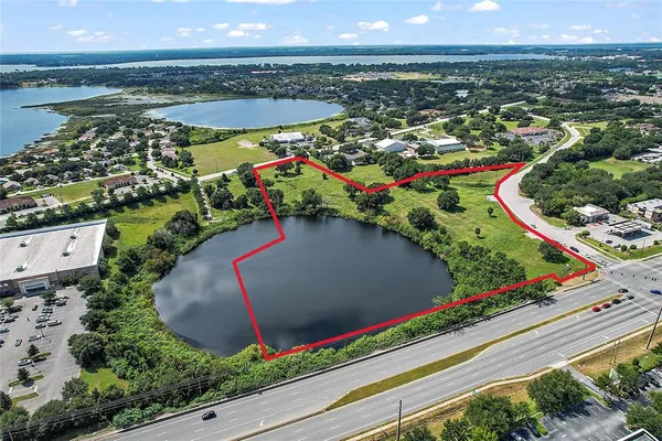 an aerial view of a house and outdoor space
