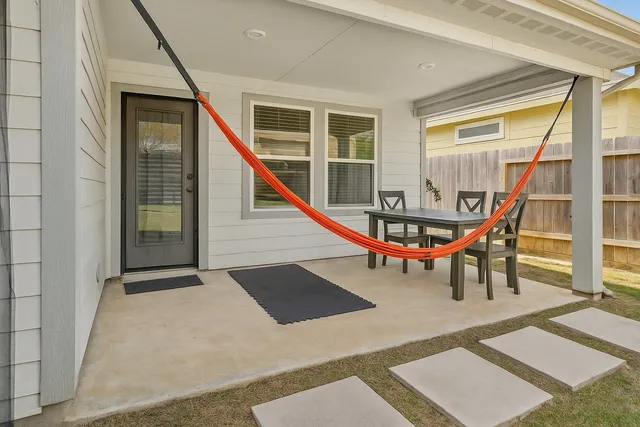 a view of staircase with furniture and windows