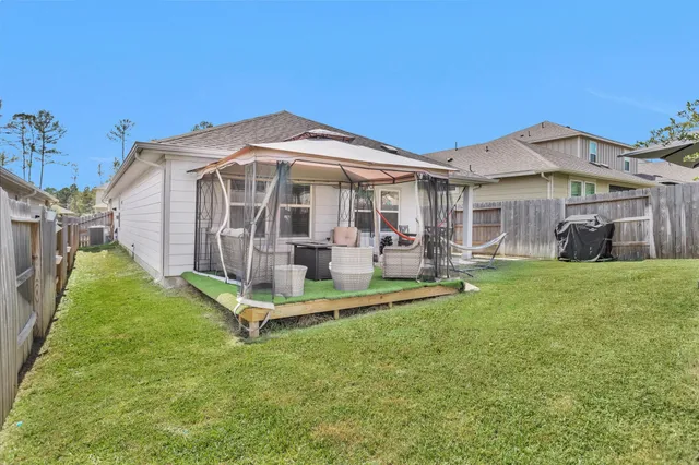 a front view of a house with a yard table and chairs