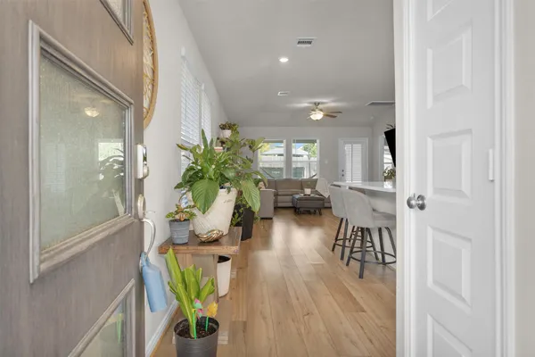 a view of living room filled with furniture and a potted plant