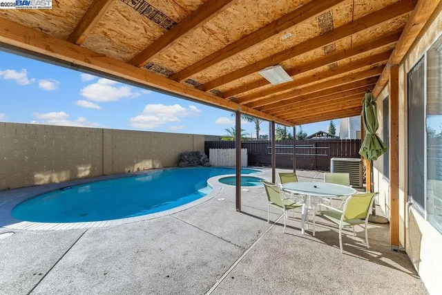 a view of balcony with two chairs and a table