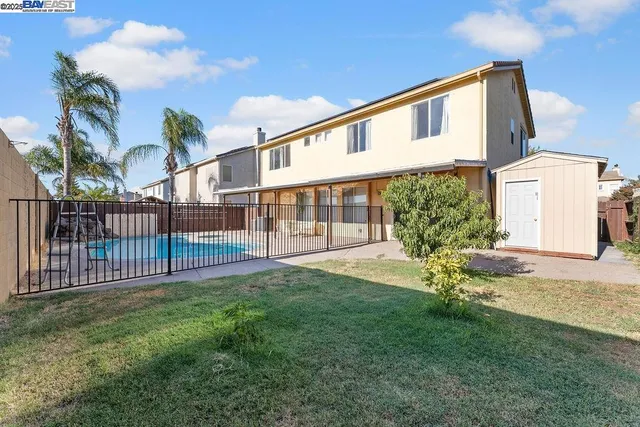 an aerial view of a house with a ocean view