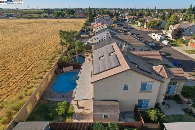 an aerial view of residential building and lake