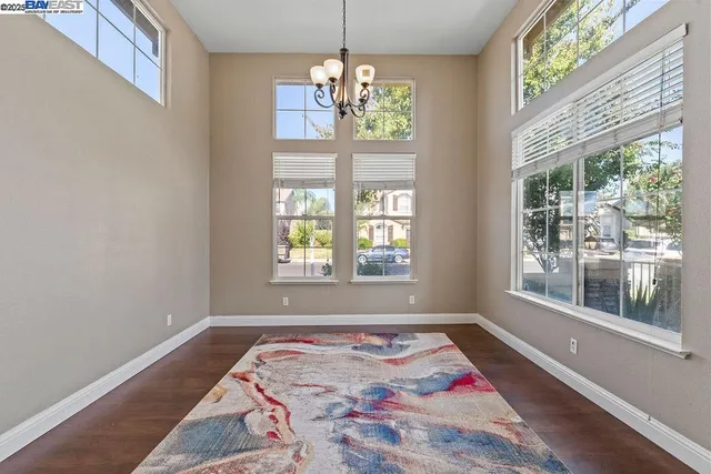 a bedroom with bed and a window