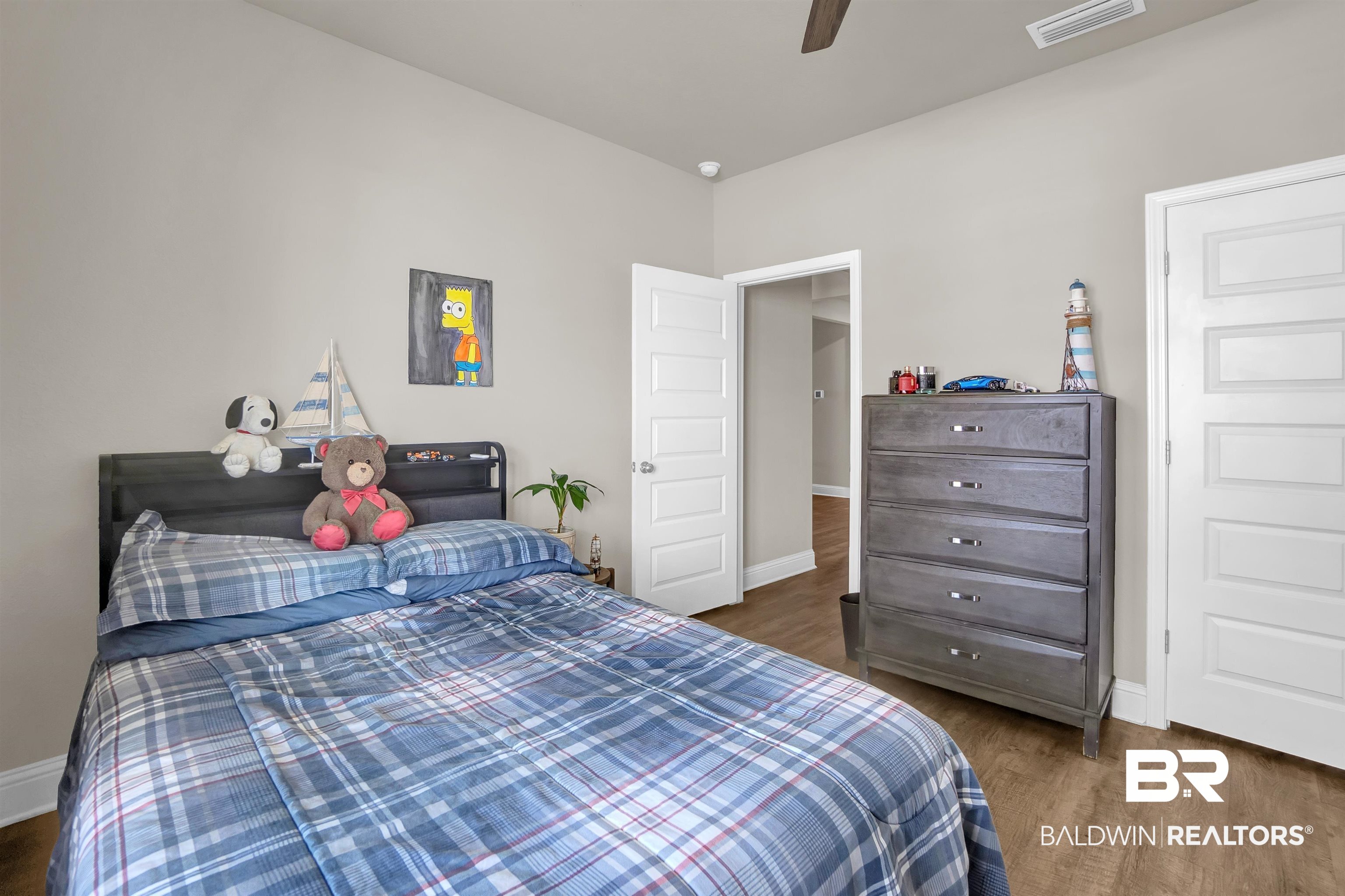 31671 Memphis Loop Daphne, AL 36527 - Photo 11 of 51 Bedroom with baseboards, dark wood-style floors, visible vents, and ceiling fan