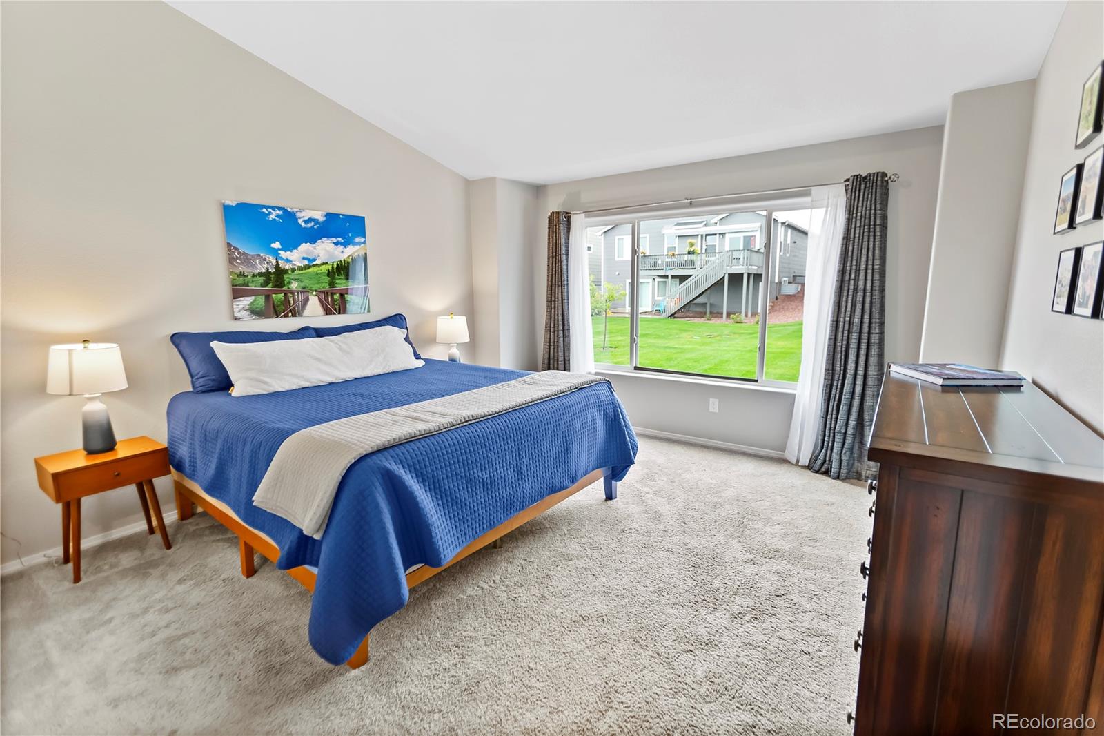 10687 Hidden Brook Circle Colorado Springs, CO 80908 - Photo 21 of 36 a bedroom with a bed and window