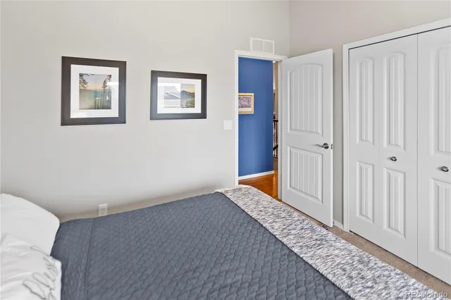 a bedroom with windows