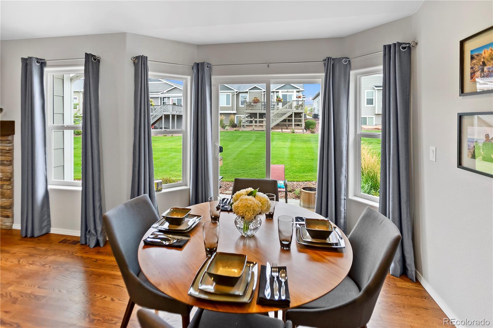 10687 Hidden Brook Circle Colorado Springs, CO 80908 - Photo 27 of 36 a view of a dining room with furniture window and outside view