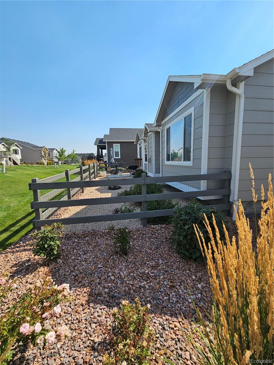 10687 Hidden Brook Circle Colorado Springs, CO 80908 - Photo 35 of 36 a view of a house with a yard