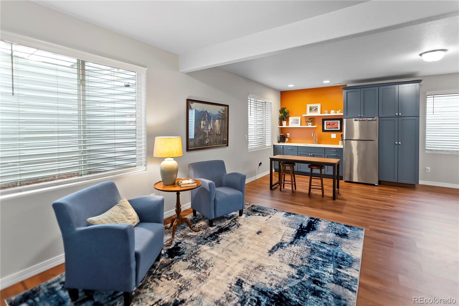10687 Hidden Brook Circle Colorado Springs, CO 80908 - Photo 4 of 36 a living room with furniture and wooden floor