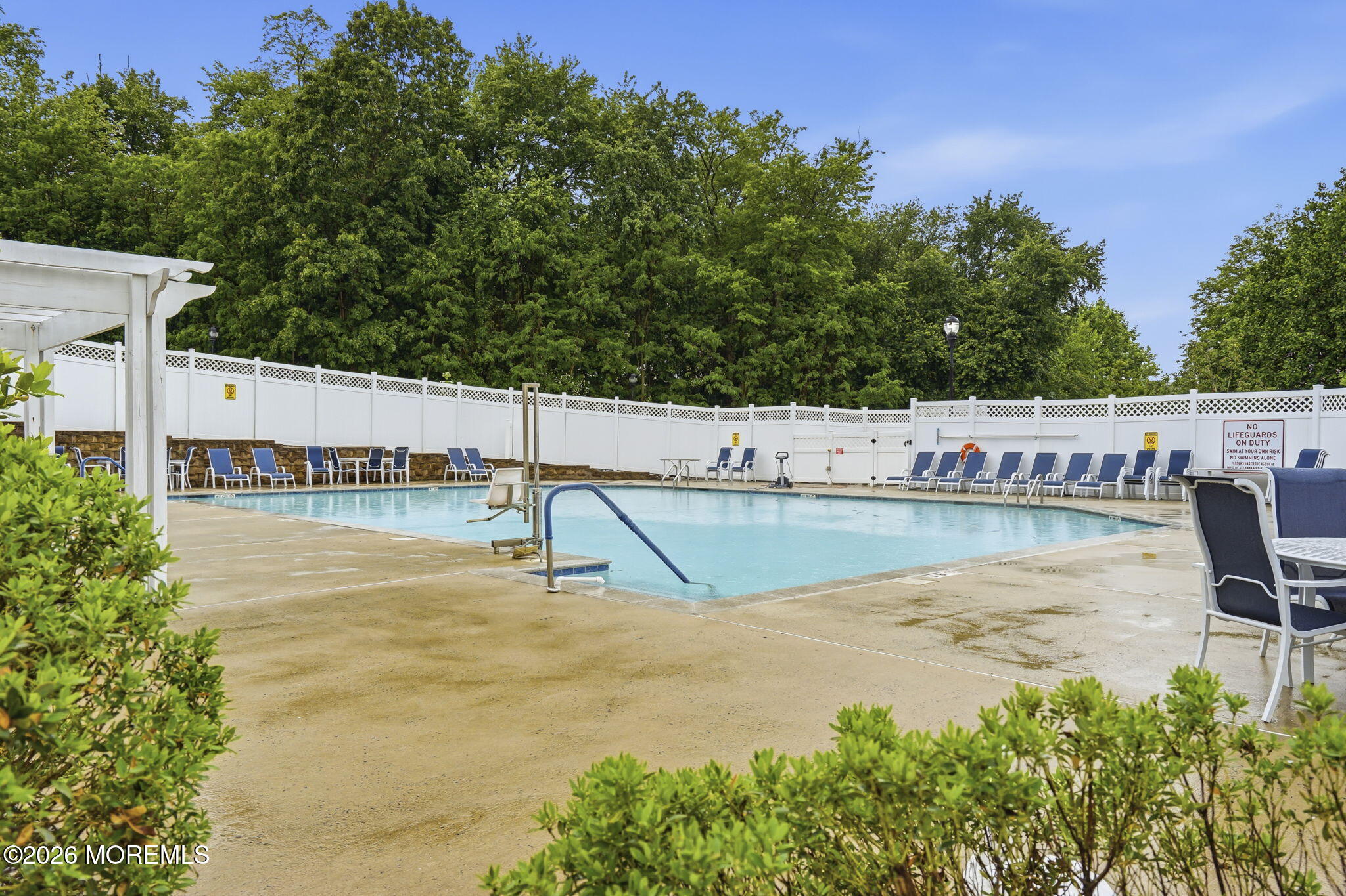 106 Potts Road Morganville, NJ 07751 - Photo 24 of 25 a view of a swimming pool with a lake view