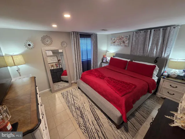 a bed room with a bed and a lamp