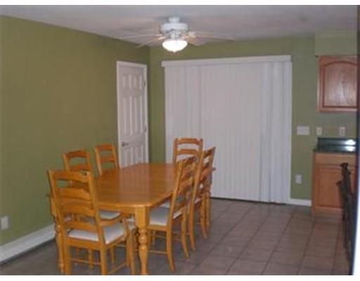 180 Corbin Road Dudley, MA 01571 - Photo 12 of 27 a view of a dining room with furniture and wooden floor