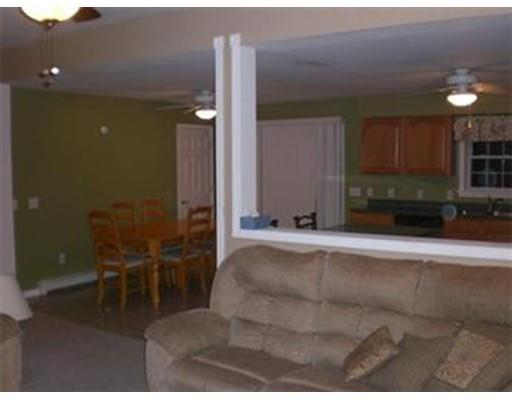 180 Corbin Road Dudley, MA 01571 - Photo 15 of 27 a living room with furniture and a rug