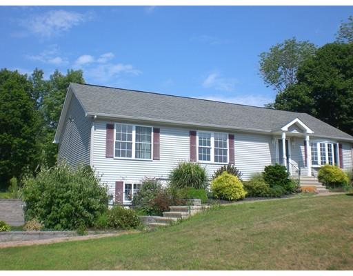 180 Corbin Road Dudley, MA 01571 - Photo 2 of 27 a front view of a house with a yard and trees