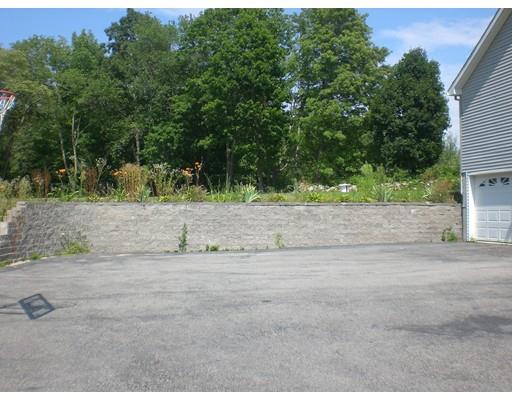 180 Corbin Road Dudley, MA 01571 - Photo 5 of 27 a backyard of a house with lots of green space