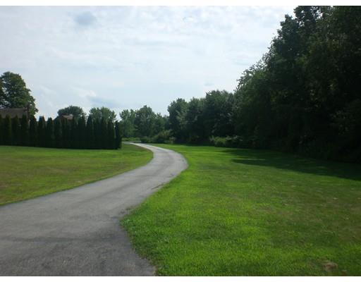 180 Corbin Road Dudley, MA 01571 - Photo 7 of 27 a view of a golf course with a garden