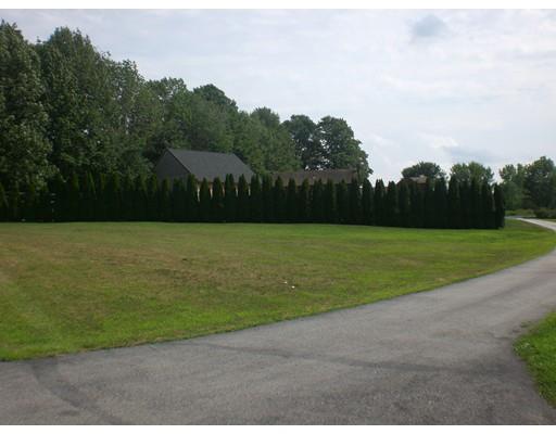 180 Corbin Road Dudley, MA 01571 - Photo 8 of 27 a view of a garden with a building in the background