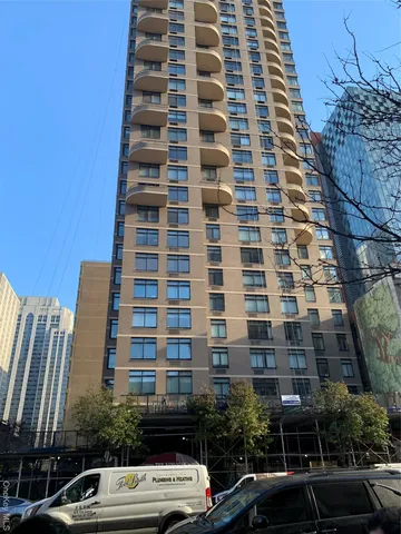 a front view of a building with parking space