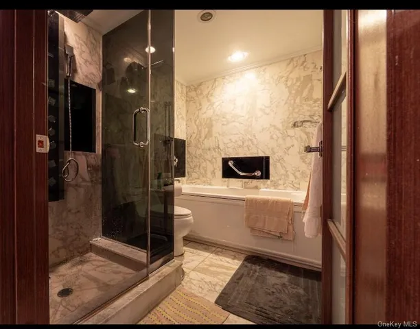 a bathroom with a shower and sink
