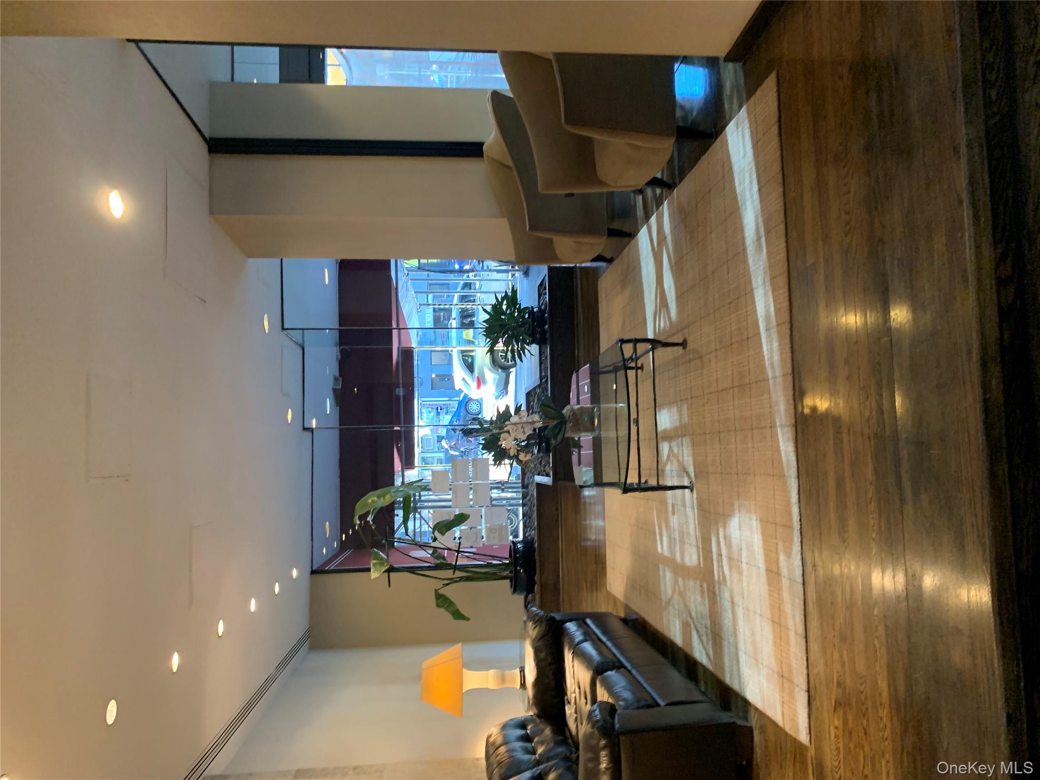 400 East 70th Street, Unit 3501 Manhattan, NY 10021 - Photo 17 of 19 Common area with expansive windows and recessed lighting