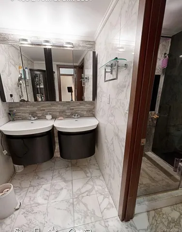 a bathroom with a bathtub sink and mirror