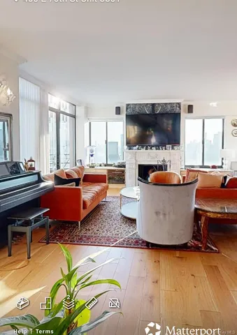 a living room with lots of furniture and a flat screen tv