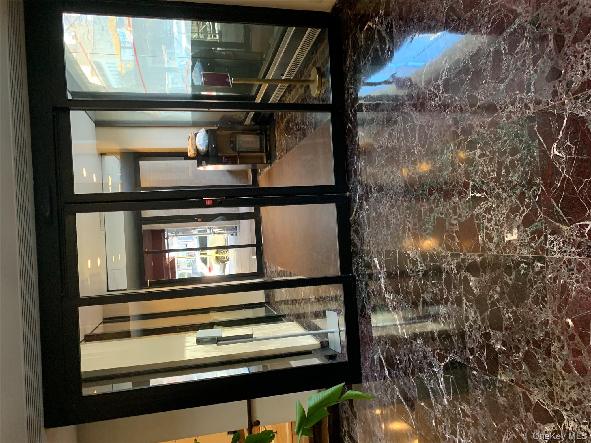 400 East 70th Street, Unit 3501 Manhattan, NY 10021 - Photo 2 of 21 a view of a living room and a window