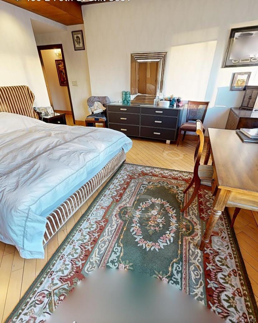 400 East 70th Street, Unit 3501 Manhattan, NY 10021 - Photo 21 of 21 a bed room with a bed