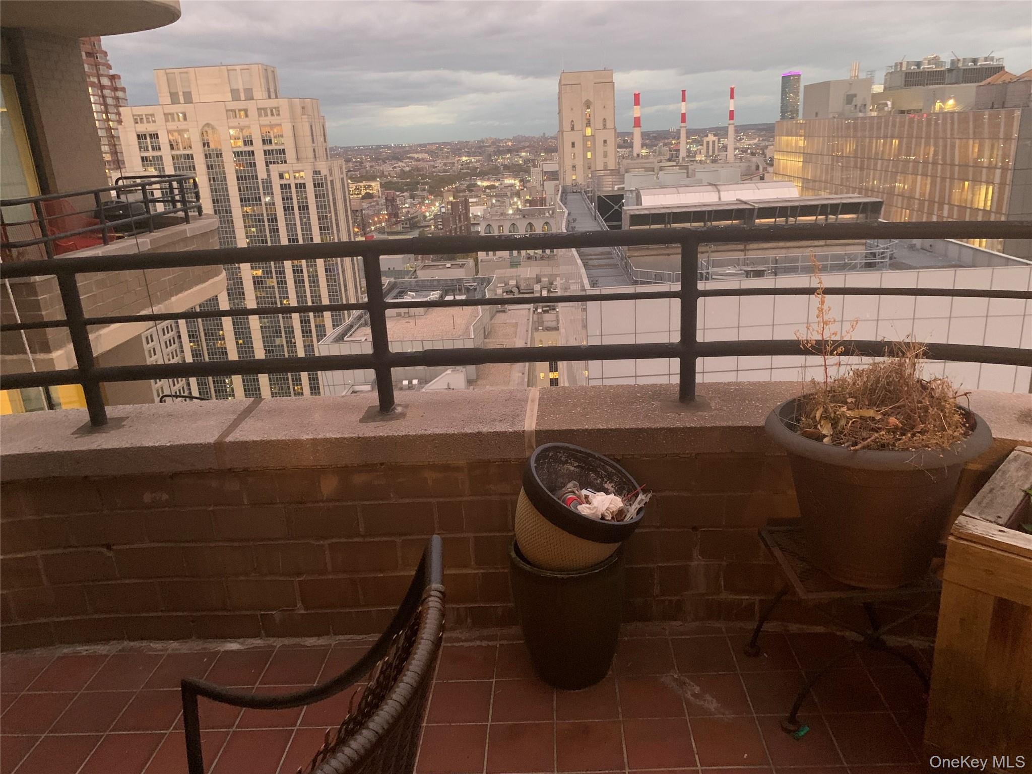 400 East 70th Street, Unit 3501 Manhattan, NY 10021 - Photo 7 of 21 a view of a chairs and table on the terrace