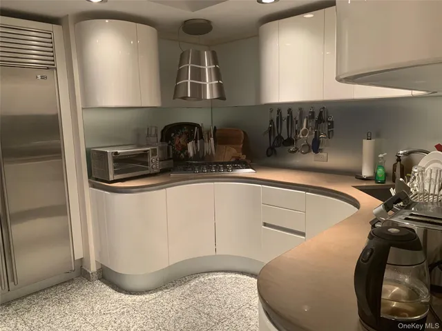 a kitchen with a sink and a stove