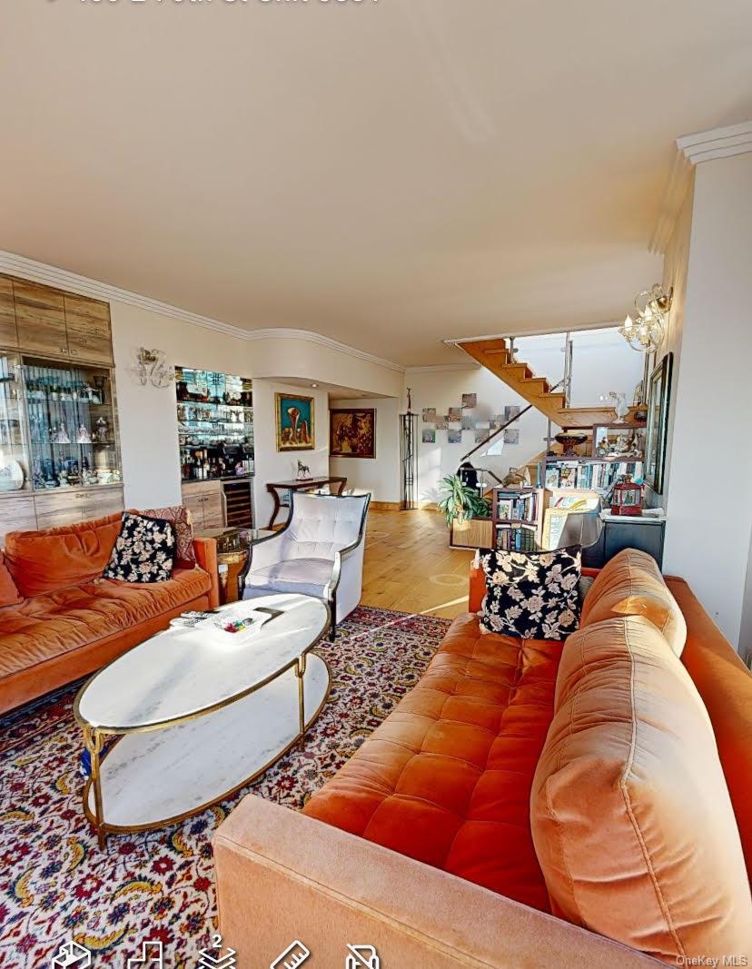 400 East 70th Street, Unit 3501 Manhattan, NY 10021 - Photo 10 of 21 a living room with furniture and a rug