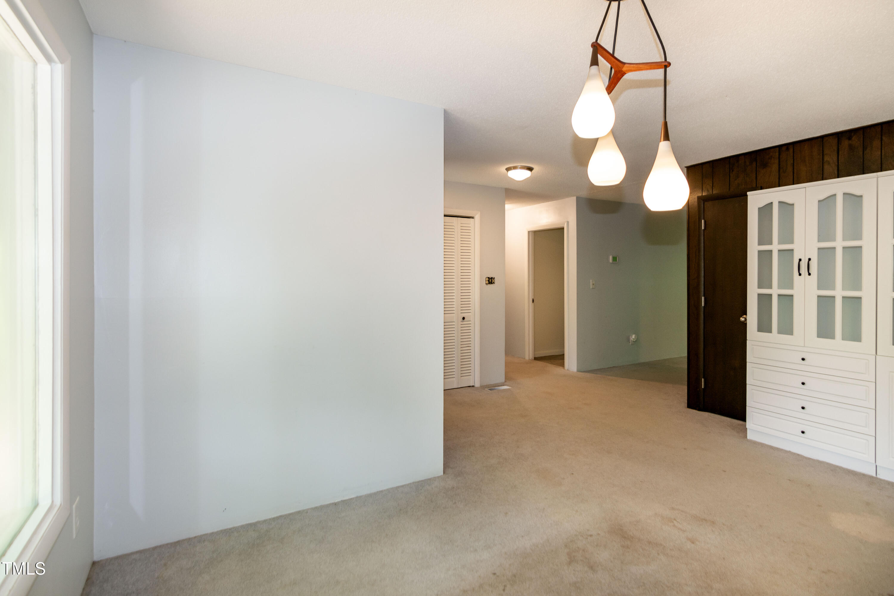5213 Tomahawk Trail Raleigh, NC 27610 - Photo 11 of 80 a view of a room with chandelier and window