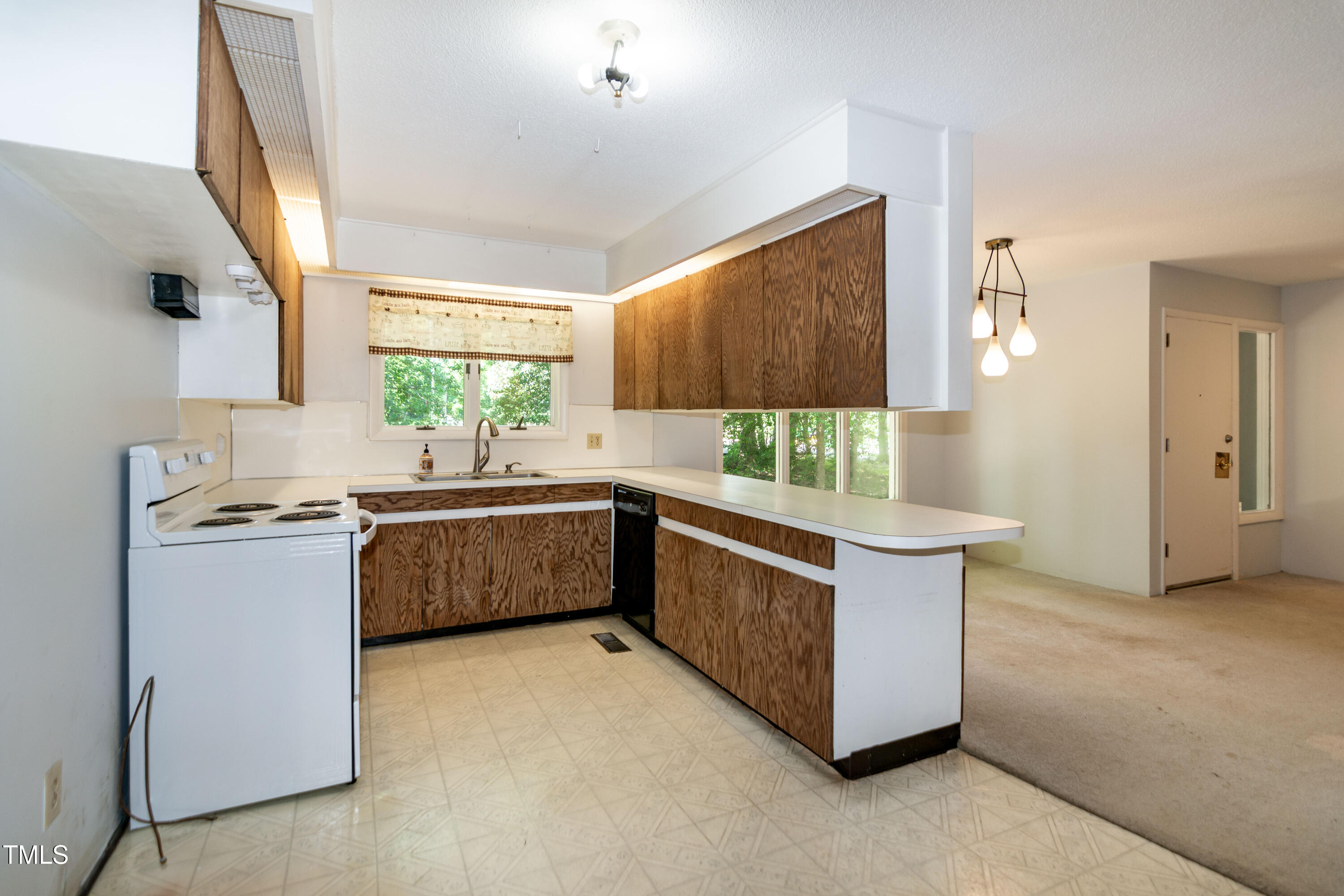 5213 Tomahawk Trail Raleigh, NC 27610 - Photo 13 of 80 a kitchen with stainless steel appliances granite countertop a sink and a stove