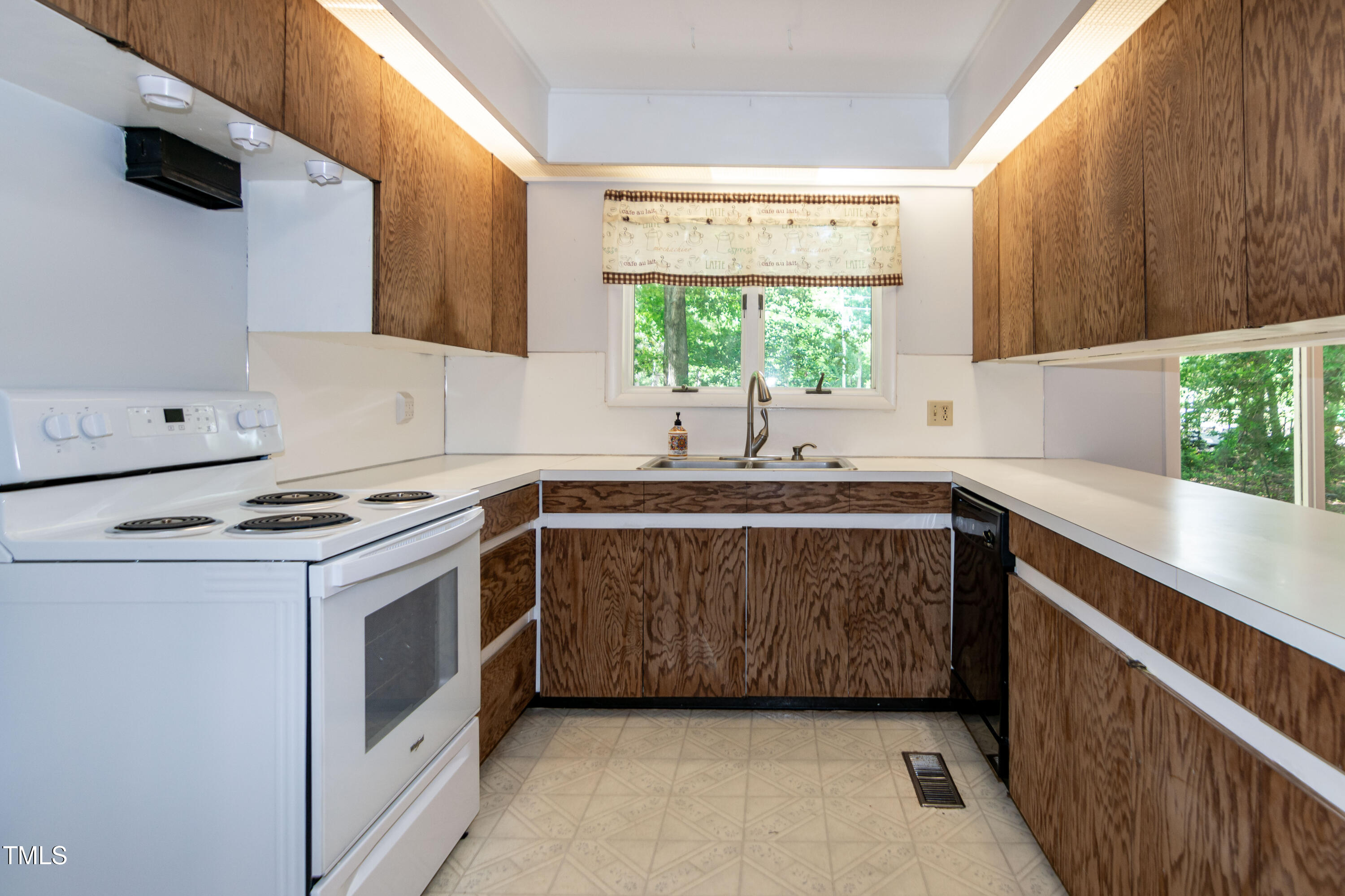 5213 Tomahawk Trail Raleigh, NC 27610 - Photo 14 of 80 a kitchen with a sink stove and cabinets