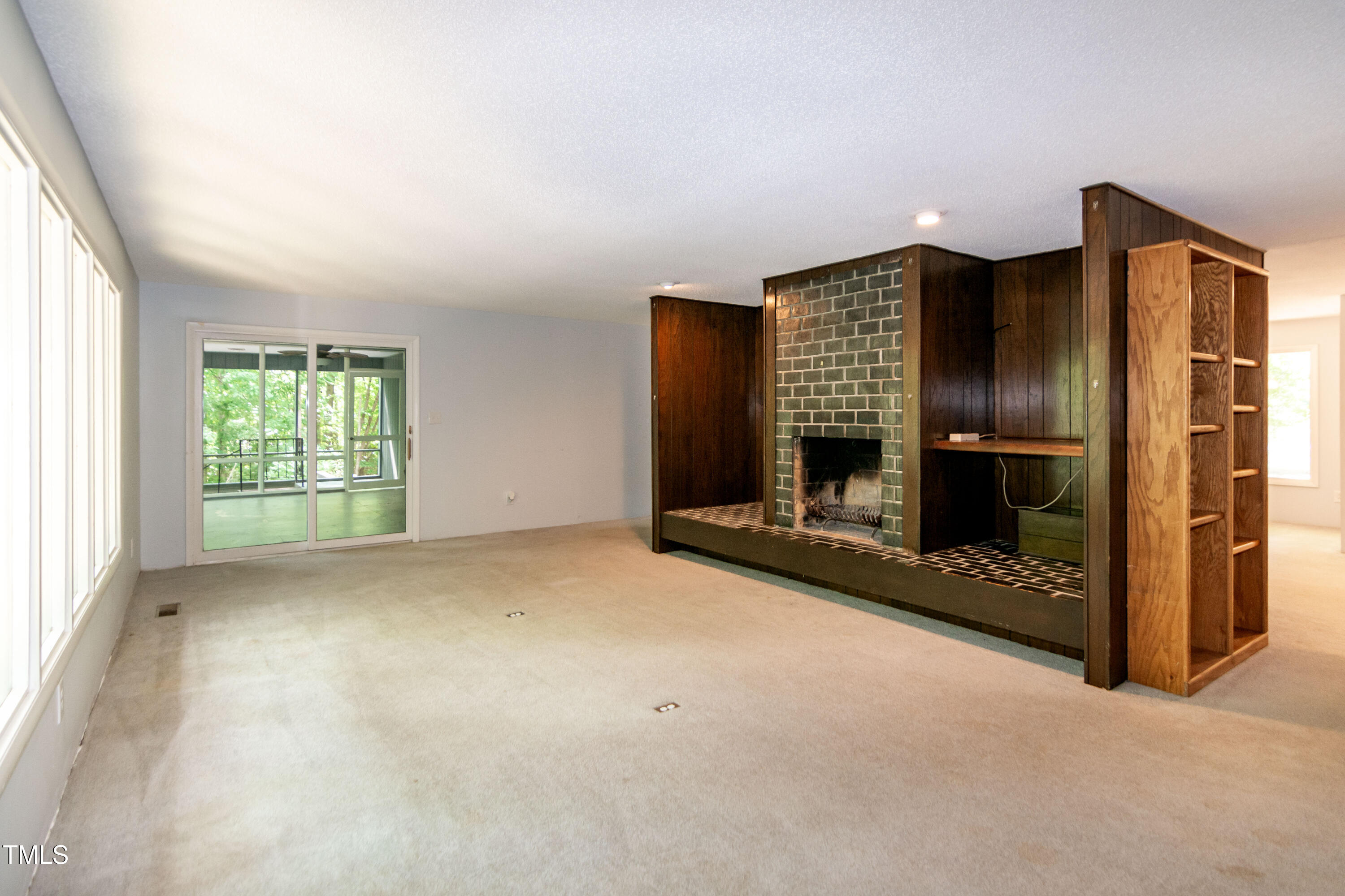 5213 Tomahawk Trail Raleigh, NC 27610 - Photo 19 of 80 an empty room with fireplace and window