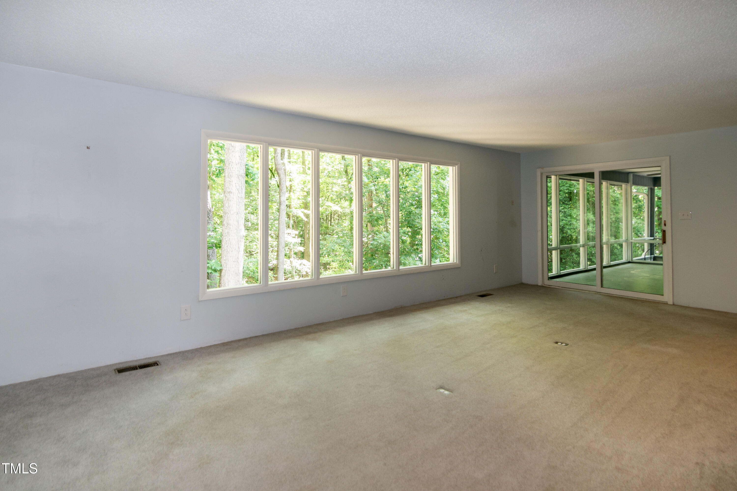 5213 Tomahawk Trail Raleigh, NC 27610 - Photo 20 of 80 an empty room with windows