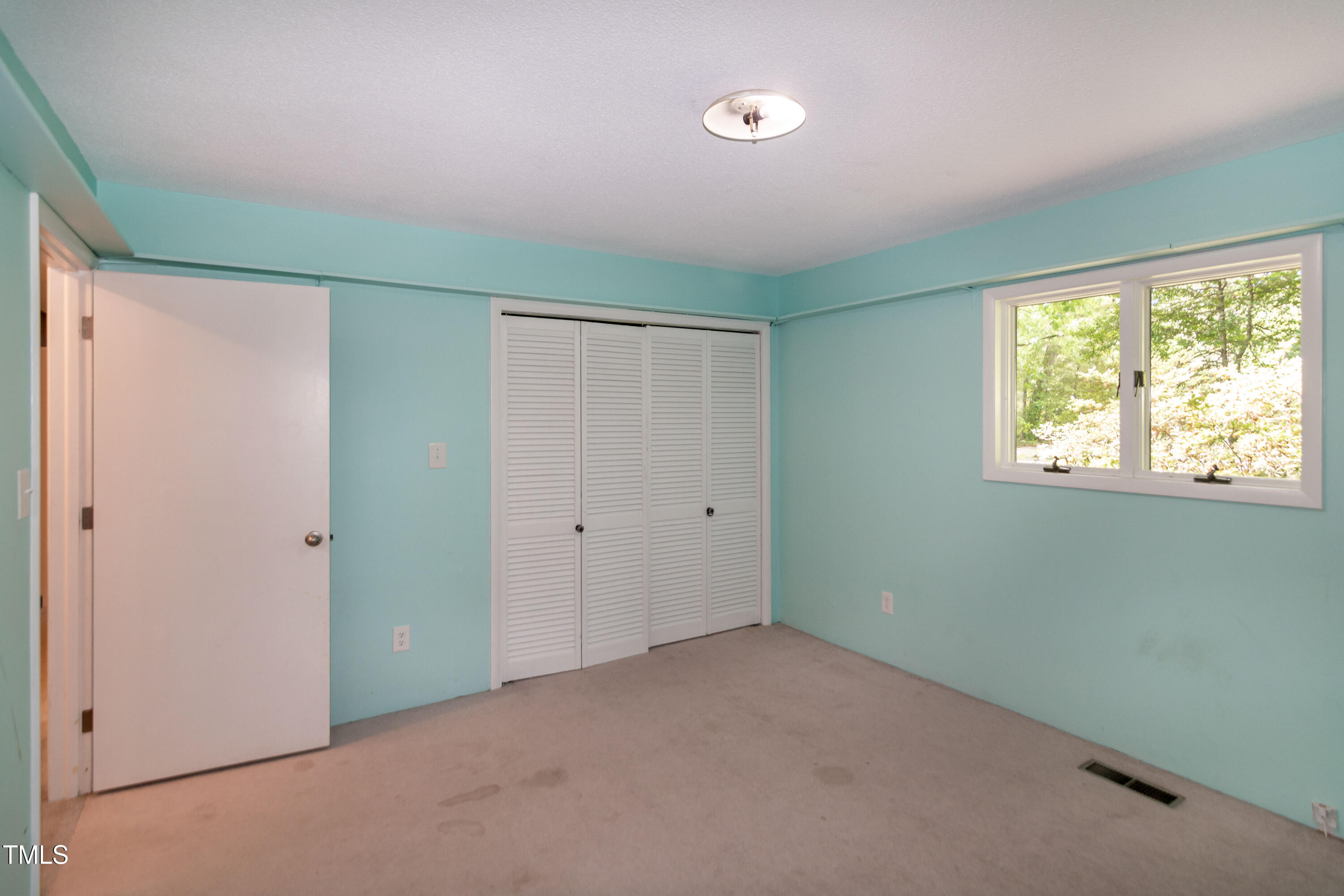 5213 Tomahawk Trail Raleigh, NC 27610 - Photo 27 of 80 a view of an empty room with a window