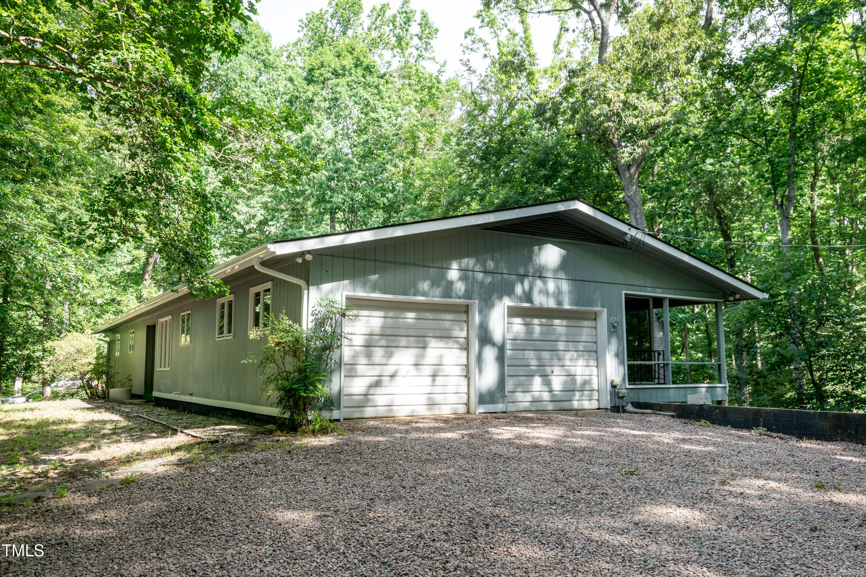 5213 Tomahawk Trail Raleigh, NC 27610 - Photo 65 of 80 a front view of a house with a garden and yard