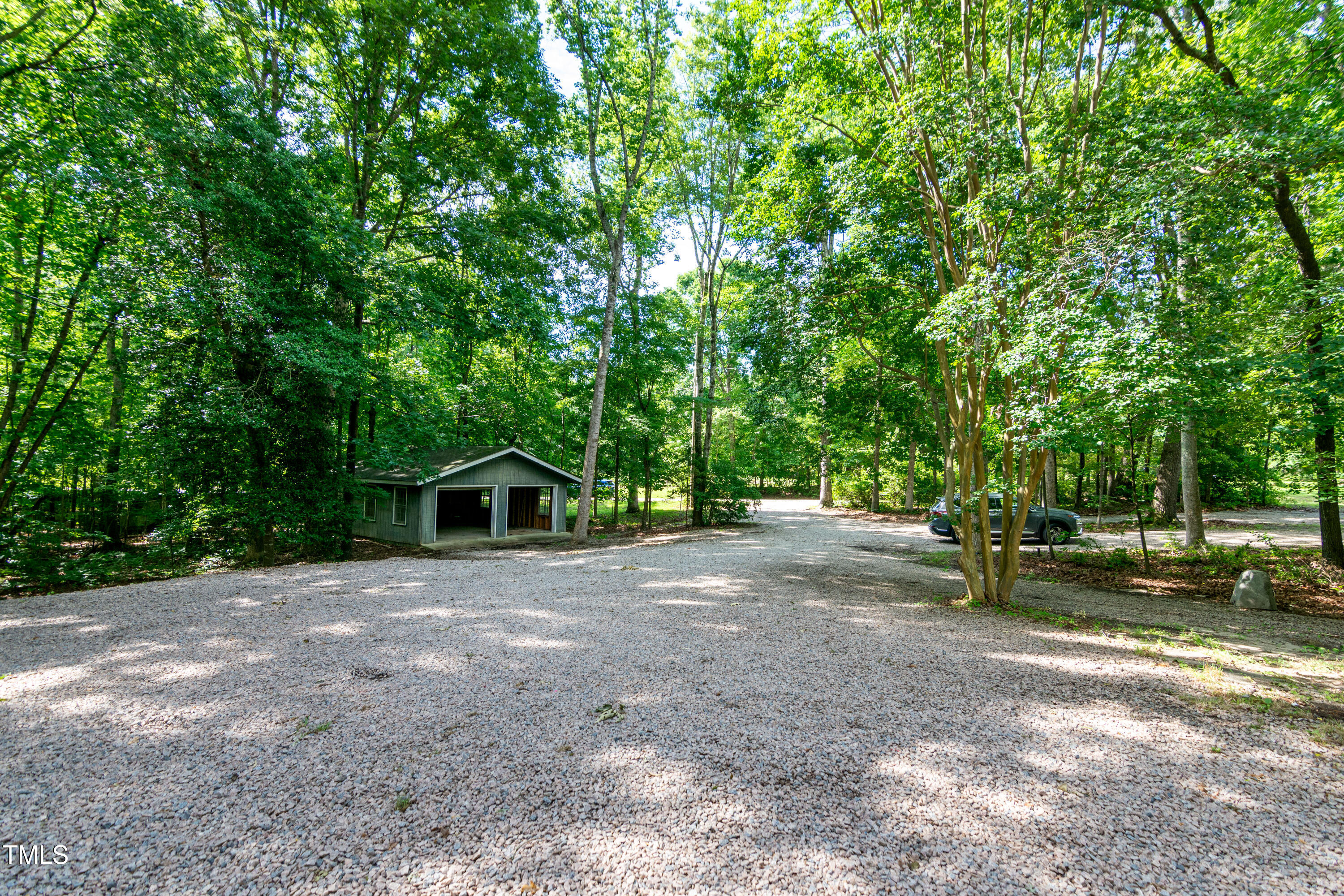 5213 Tomahawk Trail Raleigh, NC 27610 - Photo 79 of 80 a view of a house with a tree in the background