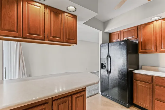 a kitchen with stainless steel appliances cabinets and a refrigerator