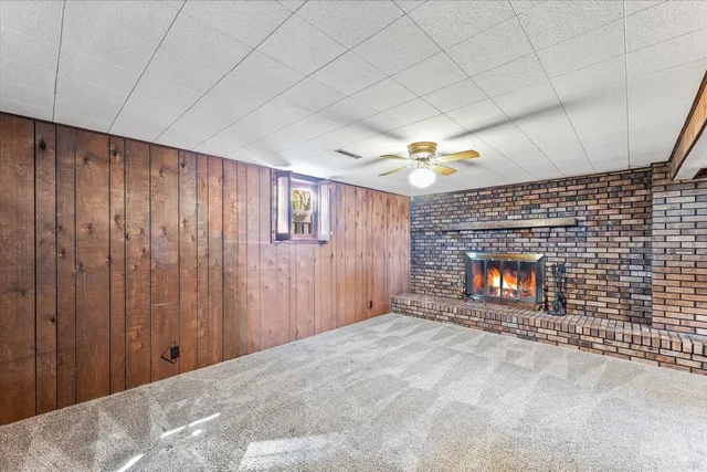 a view of an empty room and fire place